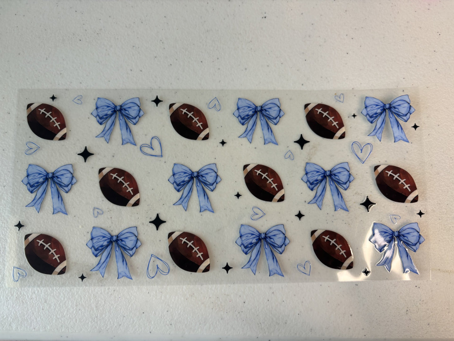Football with blue bows