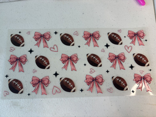 Football with pink bows